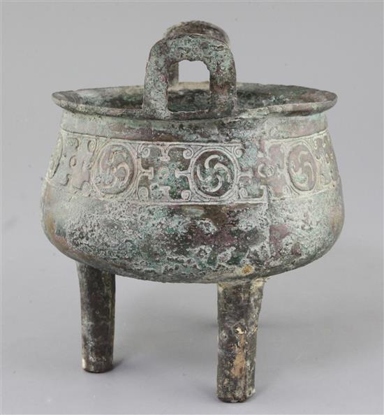 A Chinese archaic bronze tripod ritual food vessel, Ding, Western Zhou dynasty, 11th - 8th century BC, 22cm high, slight faults